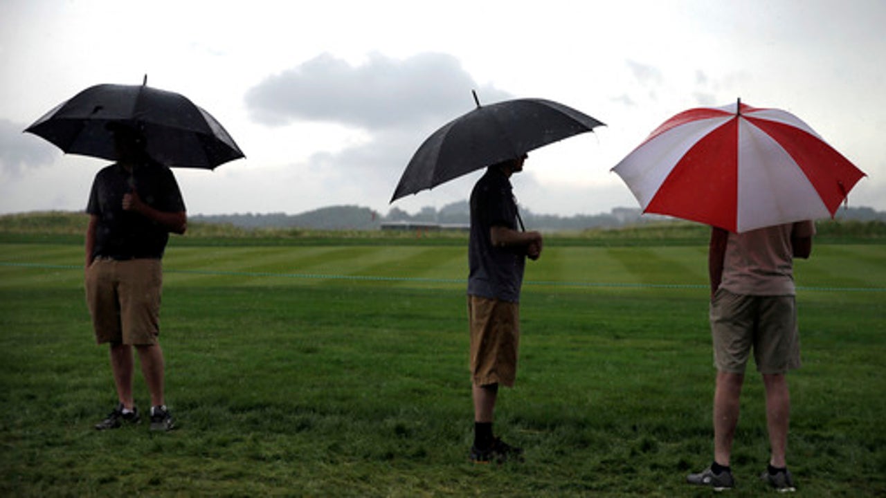 The Latest: USGA 'no-talk' policy tested during rain delay